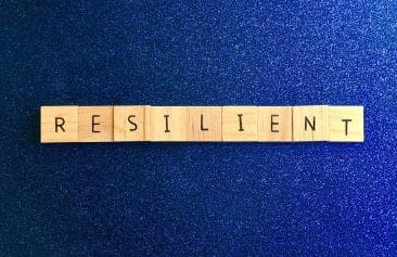 Resilient written out in wood blocks